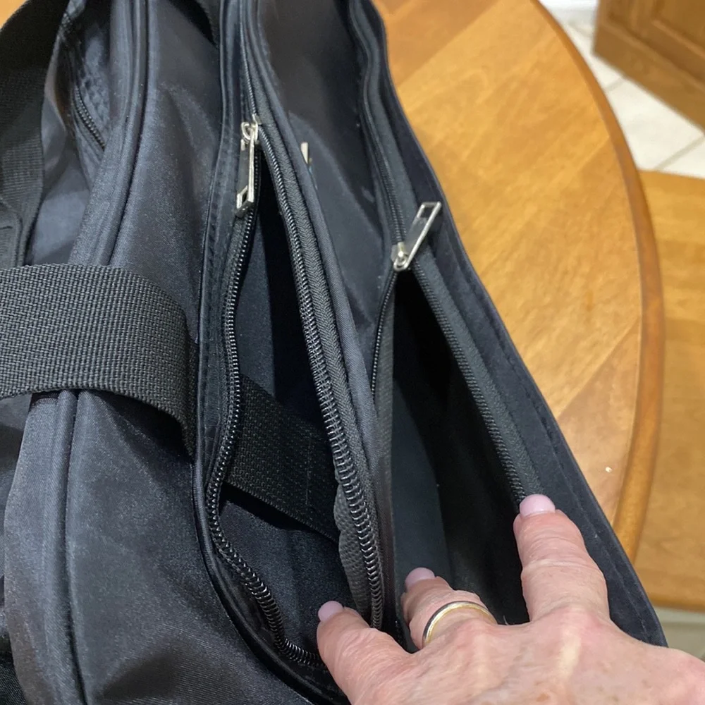 NWOT. Nylon rolling carry-on bag.